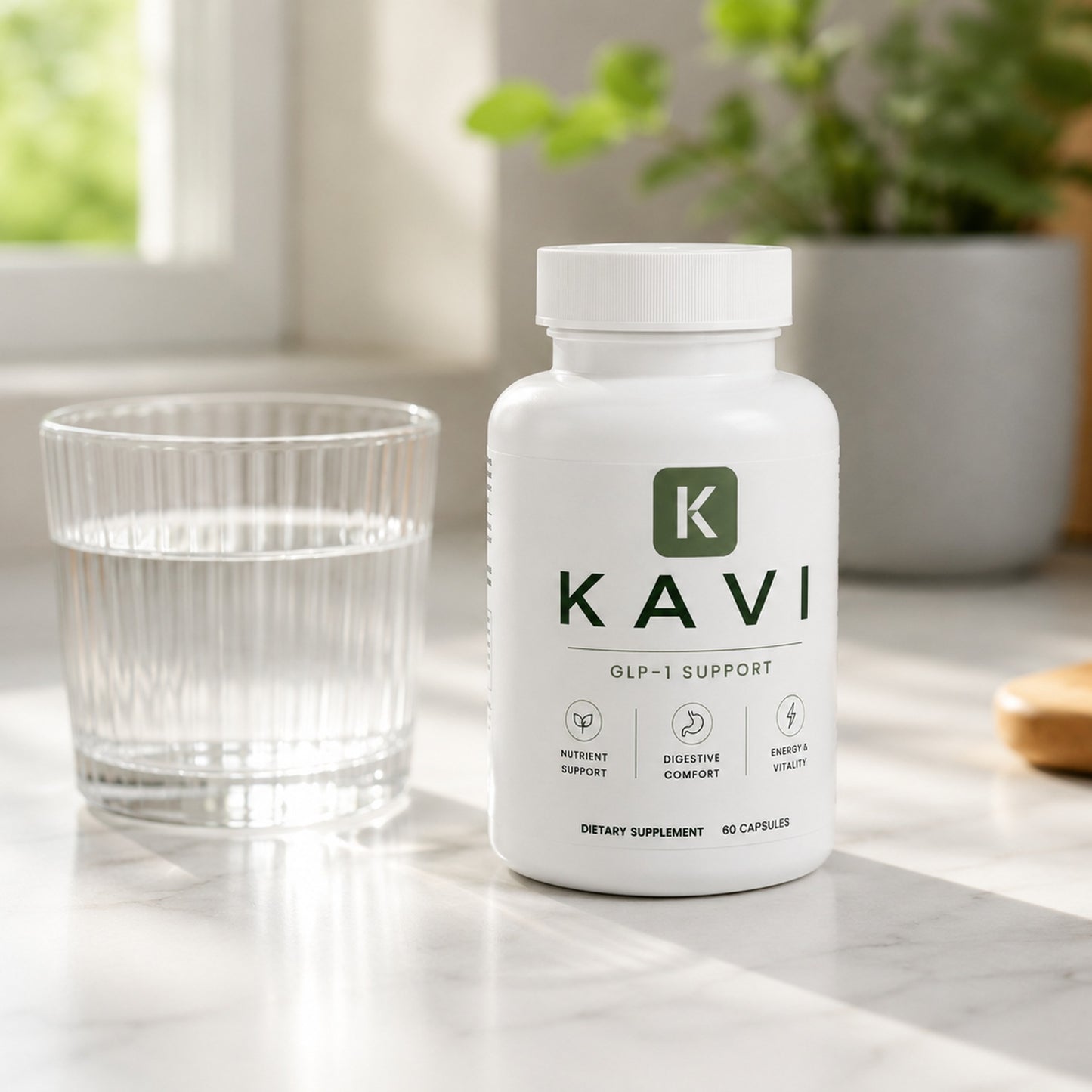Kavi GLP-1 Support bottle on a kitchen counter next to a glass of water